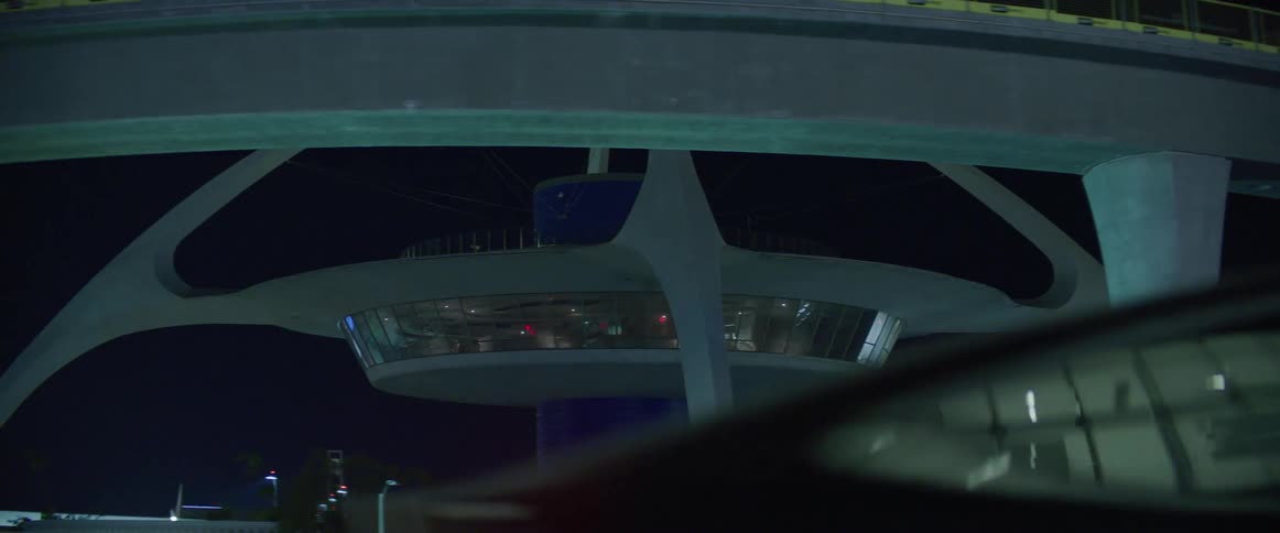 Traffic passes by the airport and radio control tower