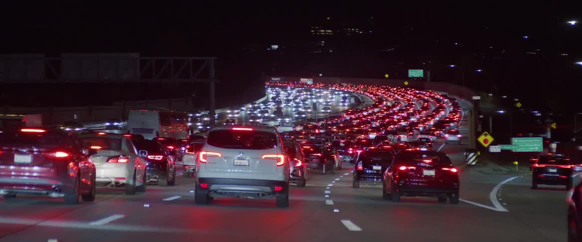 A traffic jam in the highway at night