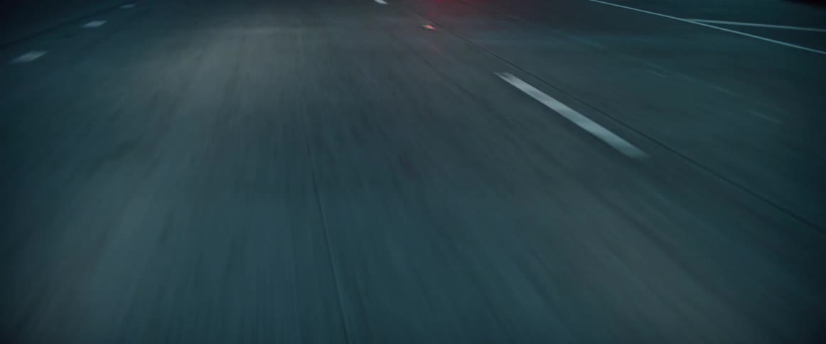 Close up of the road seen from a moving vehicle