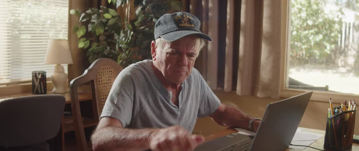 A man is frustrated while using his laptop