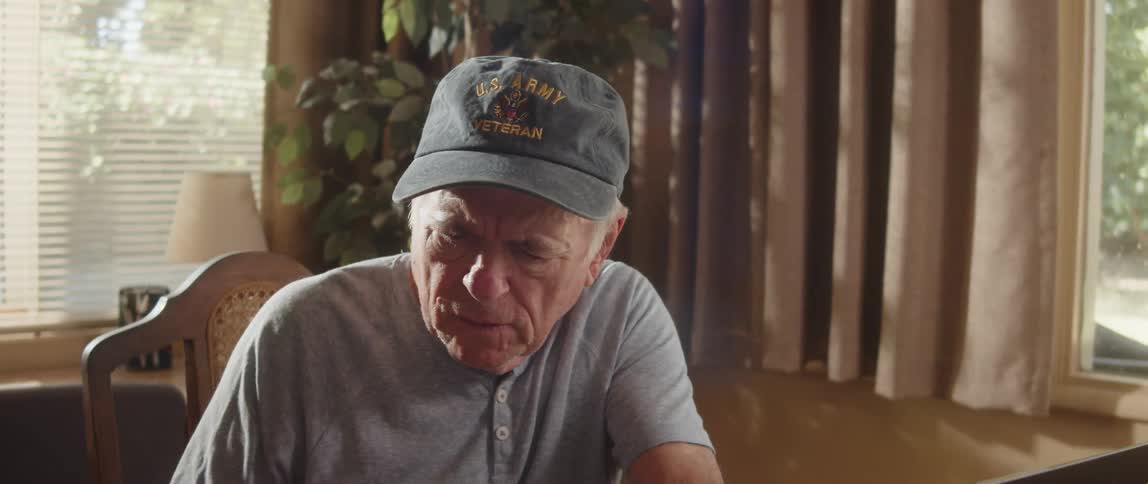 Elderly man checks documents while working from home
