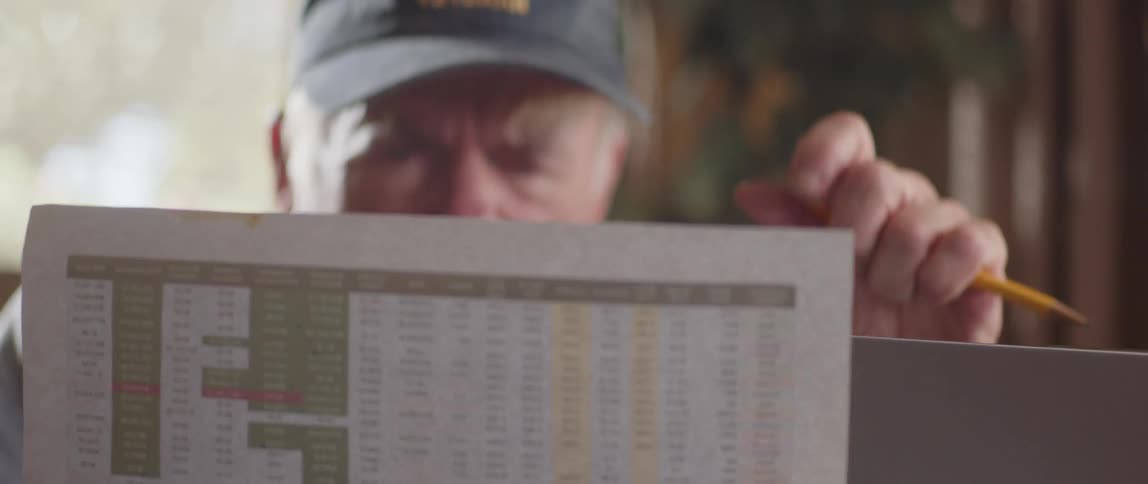 A man is reading a paper