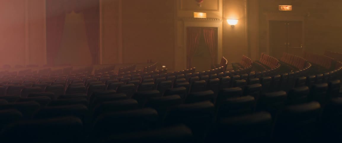 Empty rows of seats in a large theater
