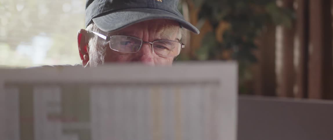 A man focused on reading important documents