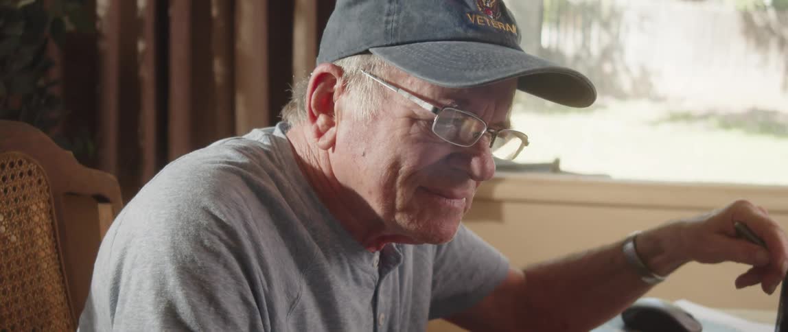 Elderly man working from home