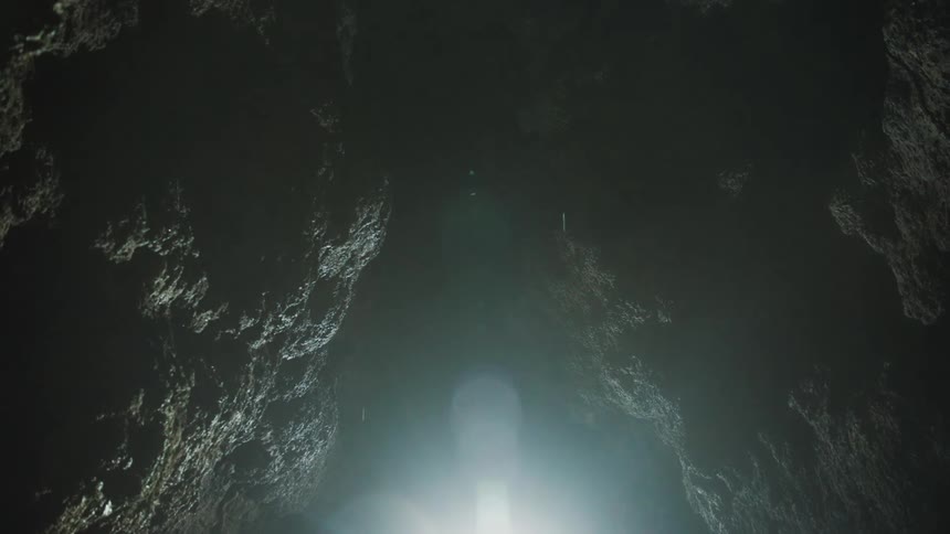 Drops of water inside a rocky cave