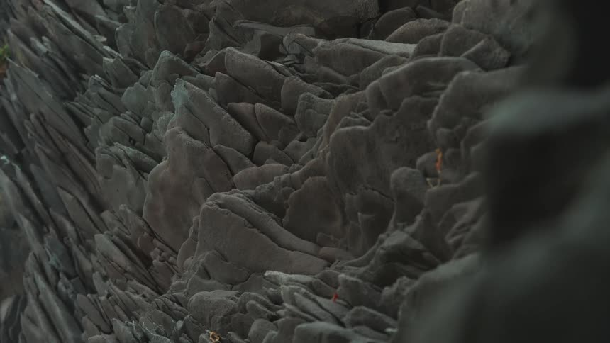 Complex and jagged rock formation with many crevices and protrusions