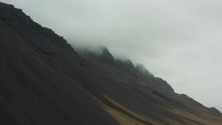 Heavy fog flows over the mountains
