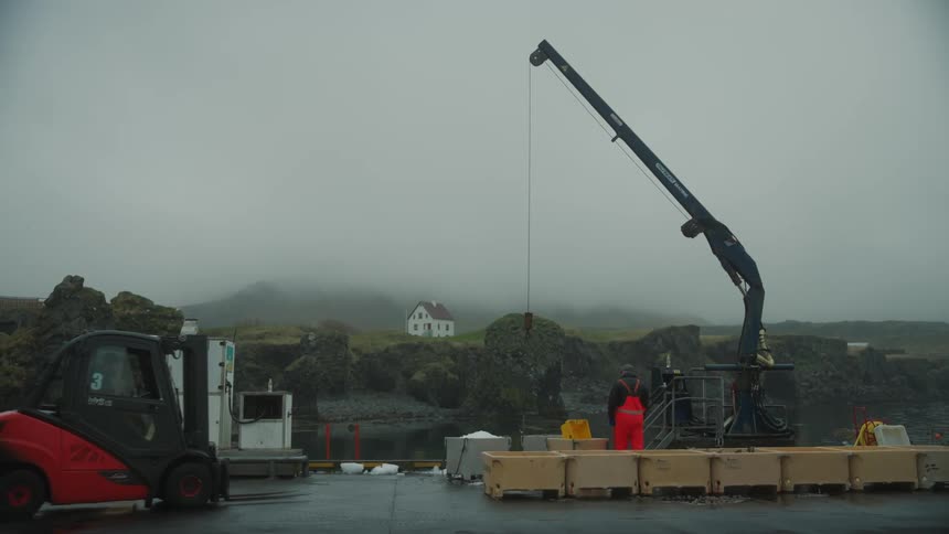 A fork lift moves crates