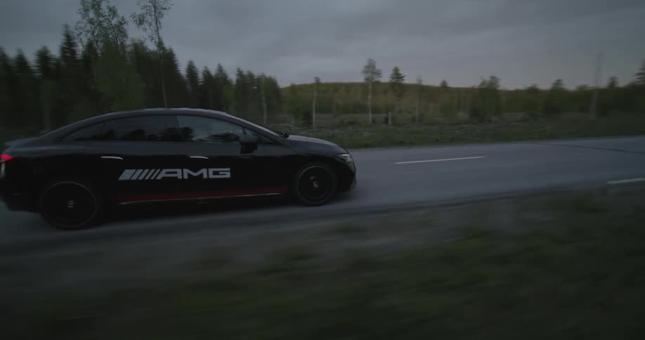 A car is racing on the highway