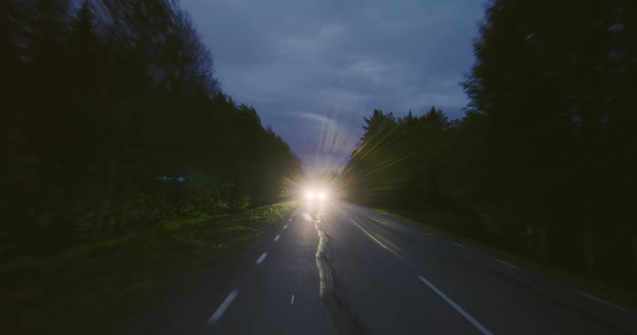 A car is driving down the highway