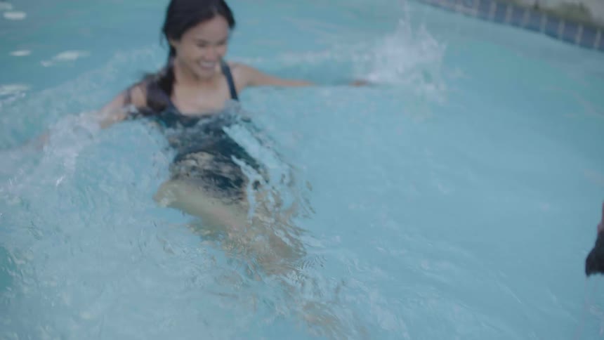 Couple playing in the pool together