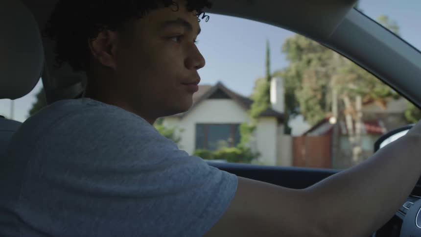 A man is driving his car