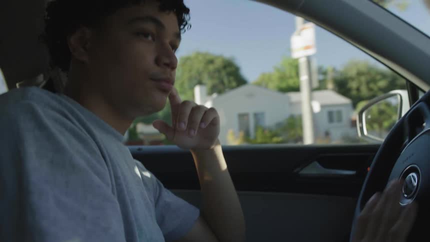 Young man driving a vehicle