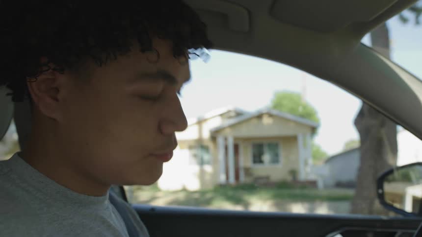 Young man sends a message while searching for an address
