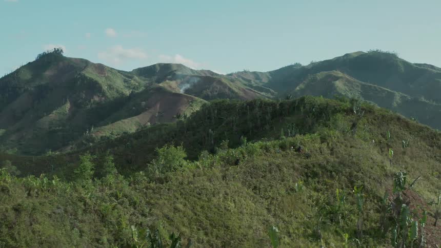 Aerial panorama of people hiking amidst the mountains