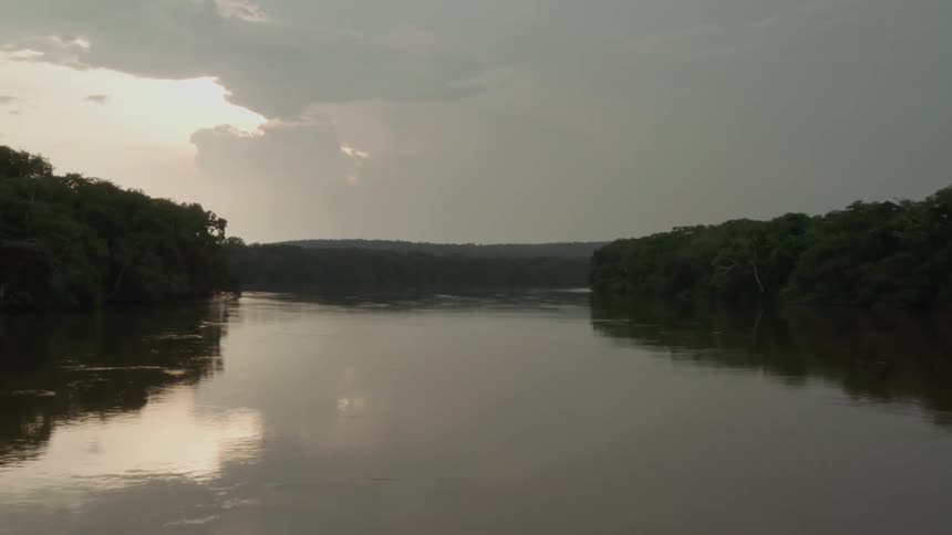 The cloudy sky reflects on the river water