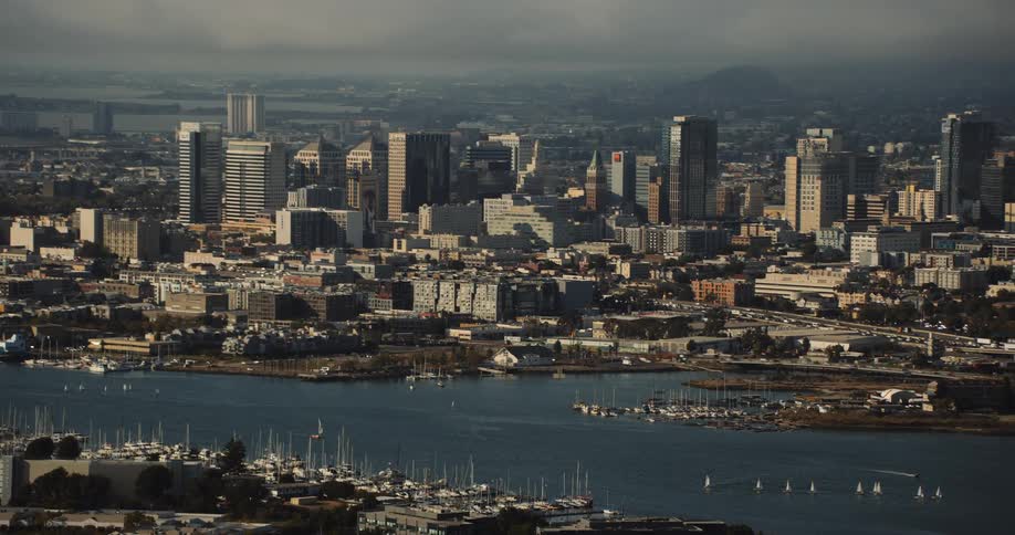 Oakland, California, skyline with sailboats on the estuary