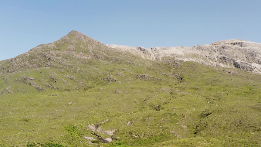 A hill covered in green grass