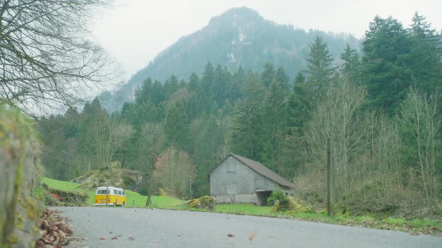 Yellow van driving through the countryside