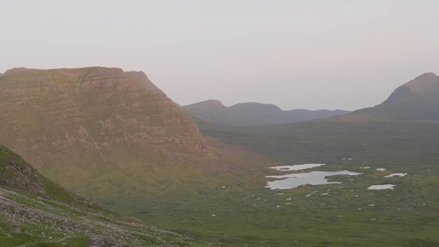 Small lakes in the valley next to the mountains