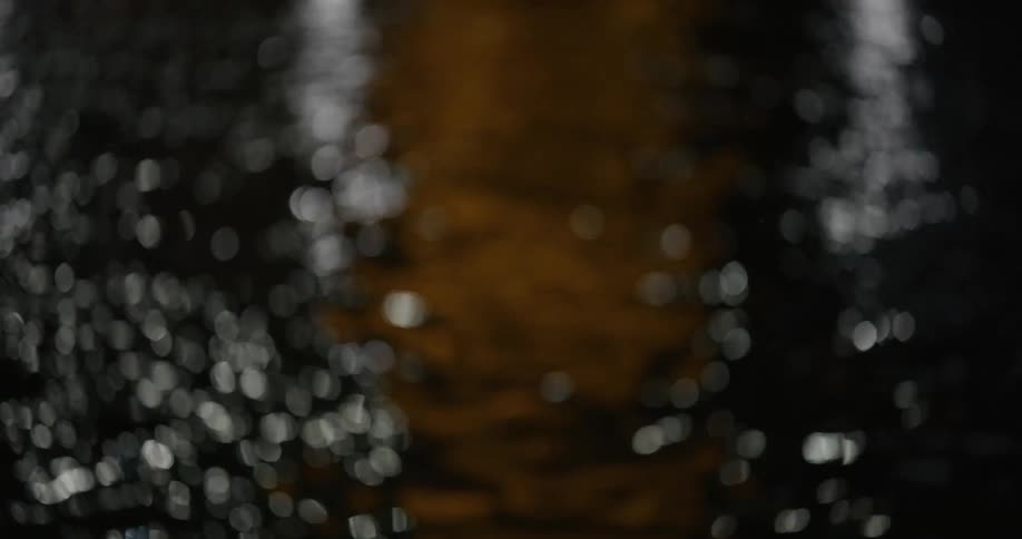 Flowing water reflects light at night