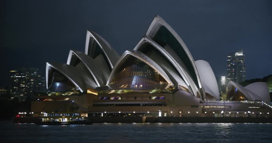 A ferry passes by the opera house