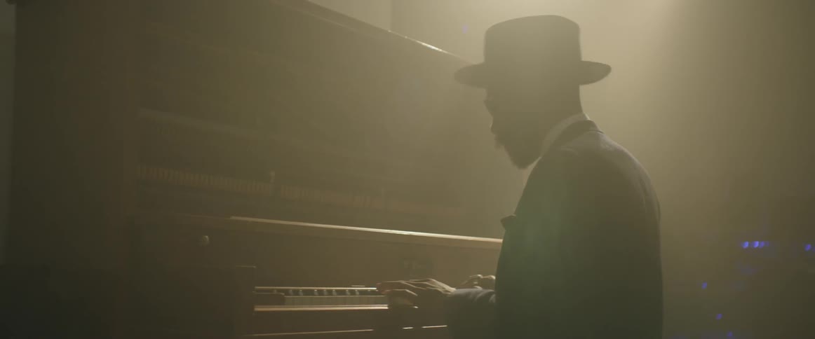 A pianist begins to play a song
