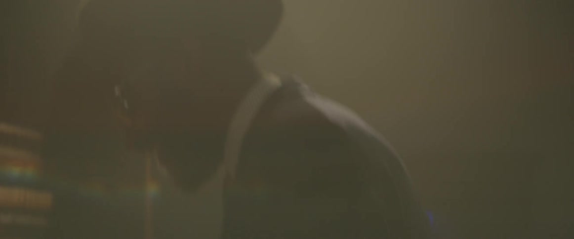 A man is performing playing the piano