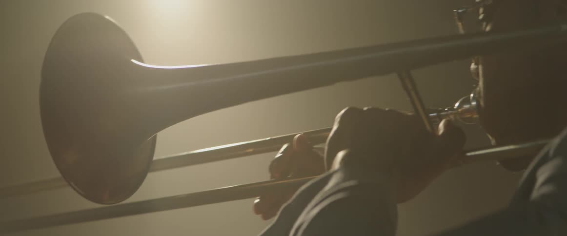 A man plays a trombone