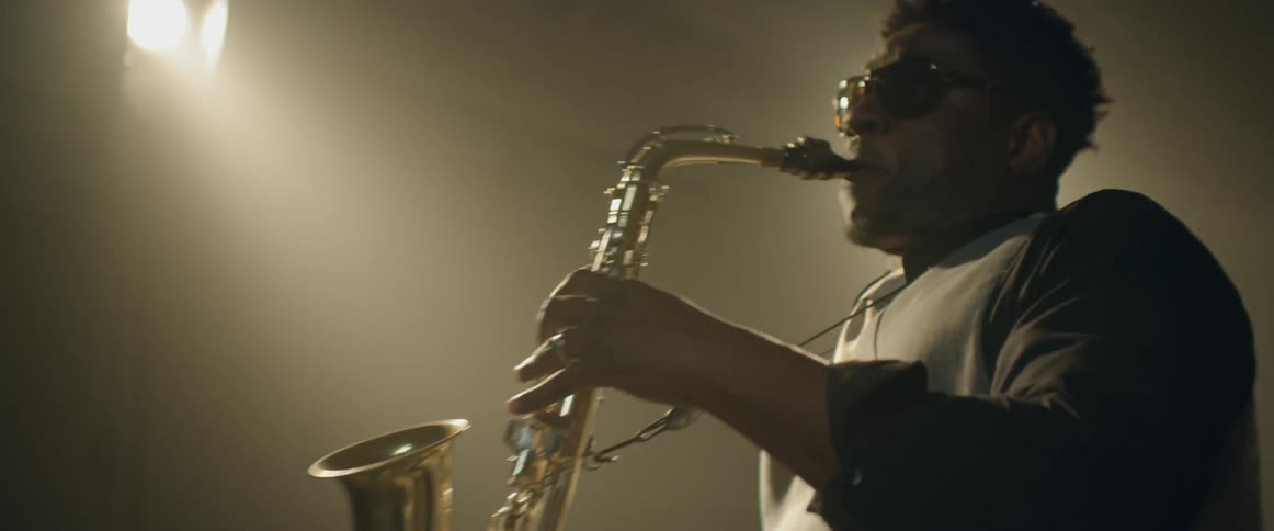 A saxophone musician plays his instrument