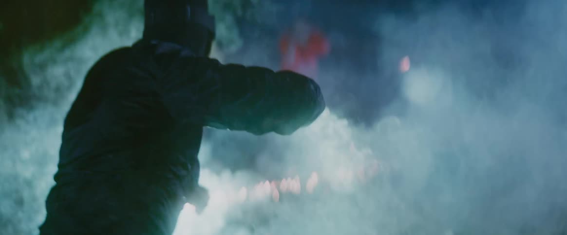 Group of men playing with fireworks at night