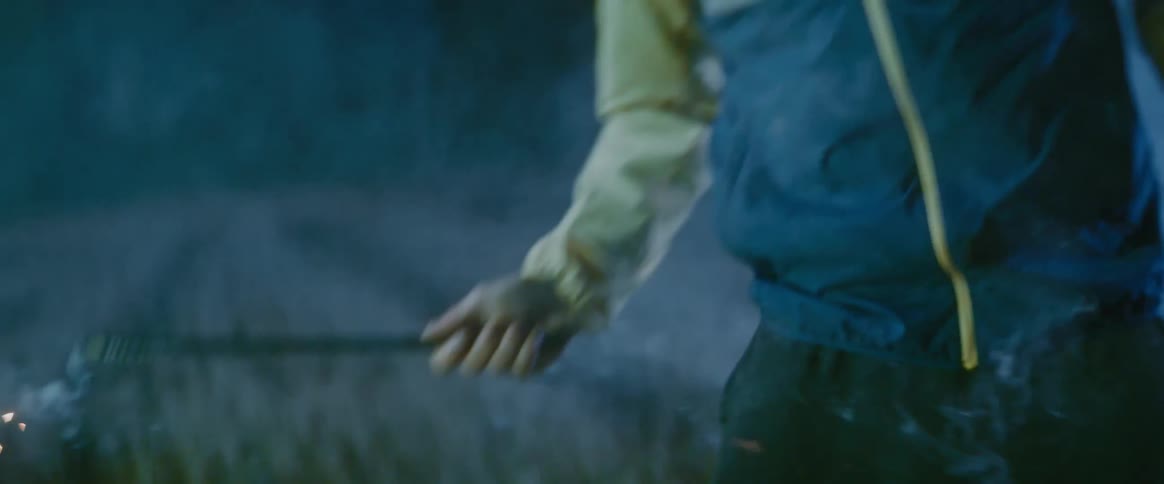 A teenager holding a wand dodges a flash then shoots sparks from his wand