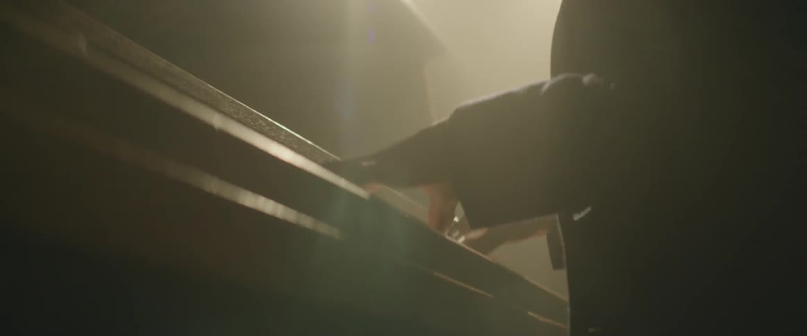 A pianist plays a song