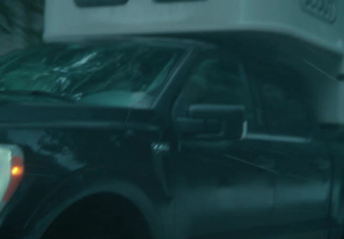 A truck is driving on the road