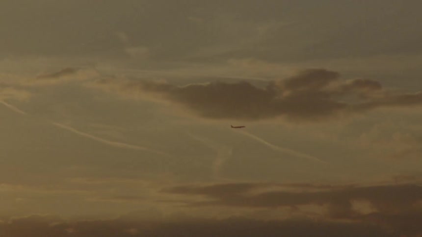 Airplane at sunset - 16mm