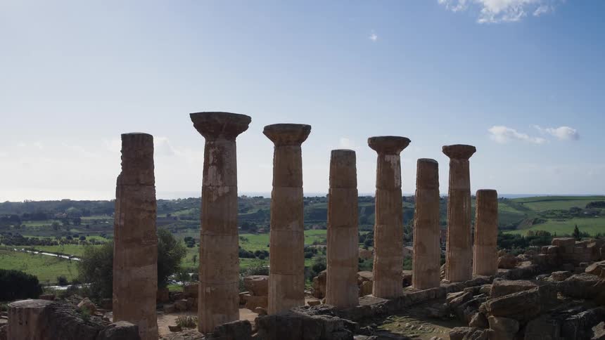 Pillars are lined up ahead on a sunny day