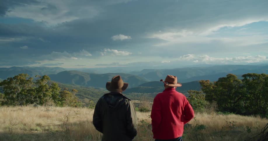 Two men look out over the horizon