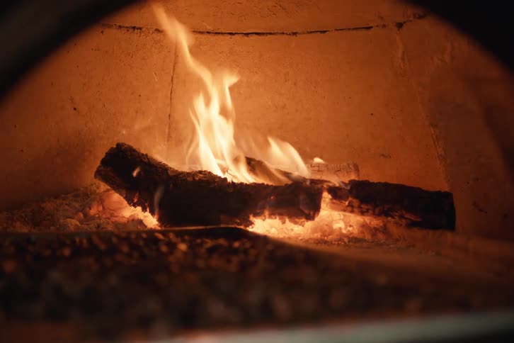 Wood logs burning in a fireplace