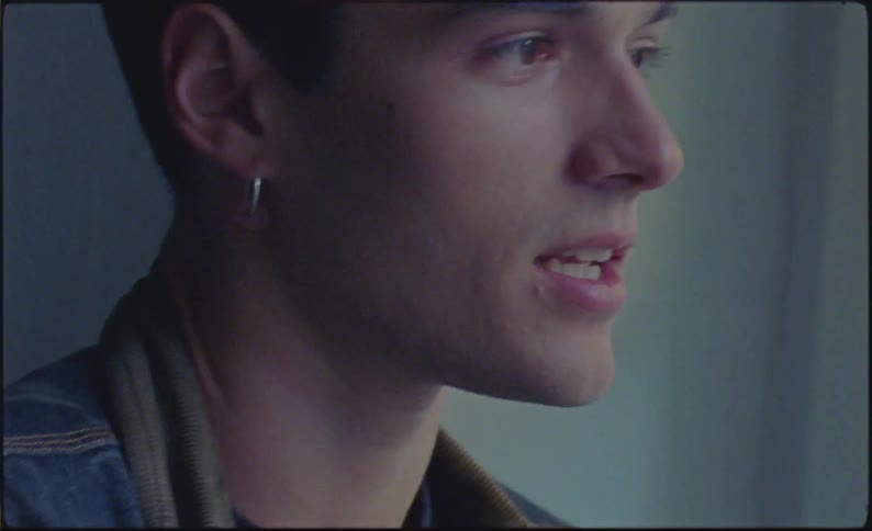 A man talking to someone at home