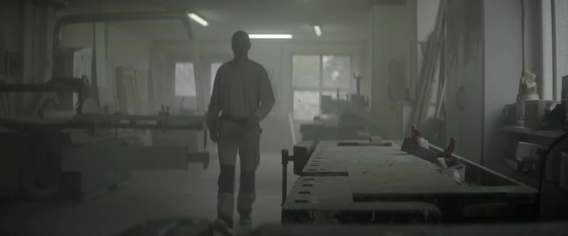 A man walks through a workshop