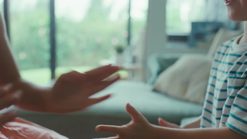 Two children playing games in a house