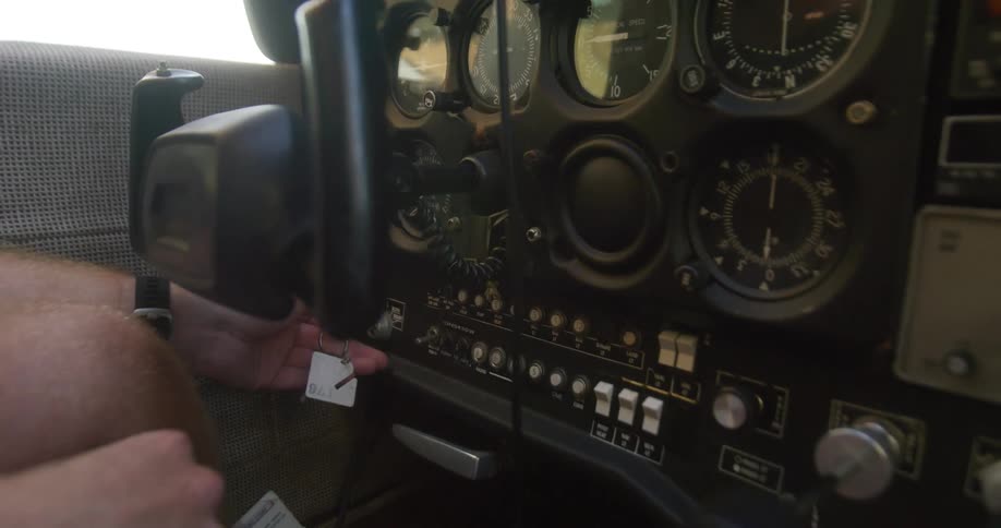 A person trying to start a car