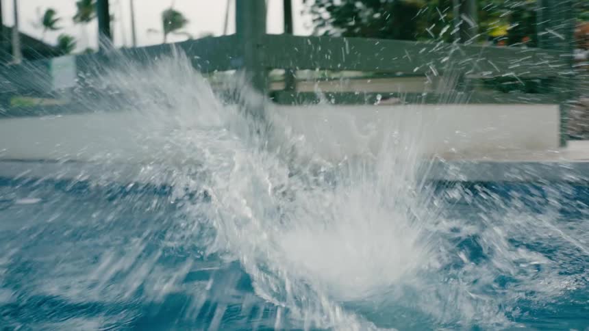 A clip of kids running and diving into the pool