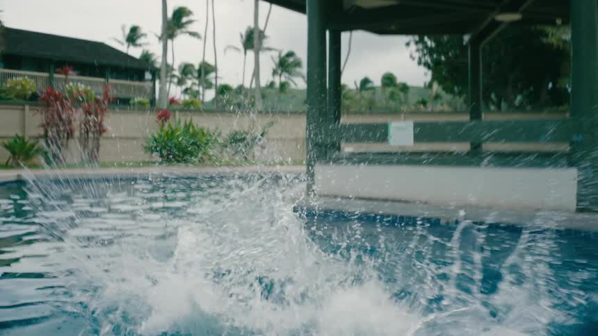 Two children jump in the pool