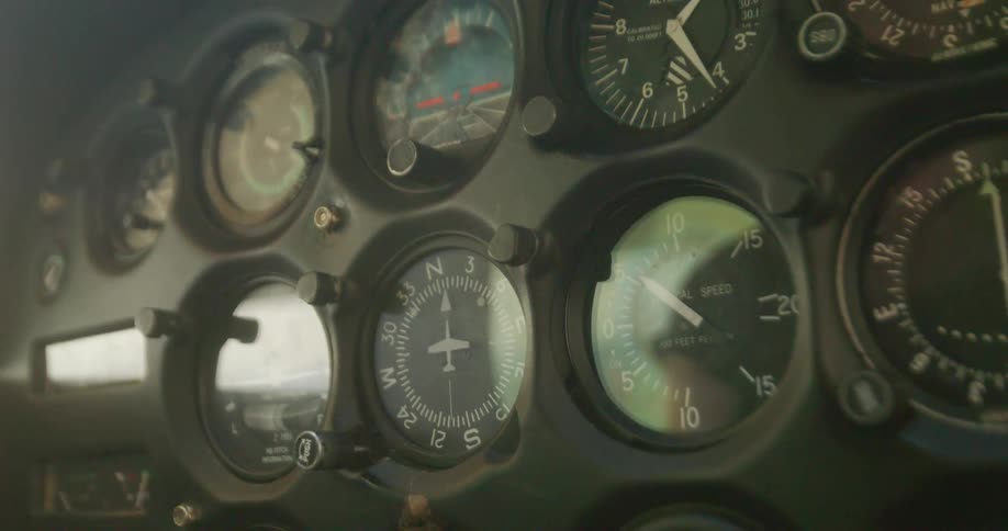 Close up of electronics and gauges on the dashboard of an airplane