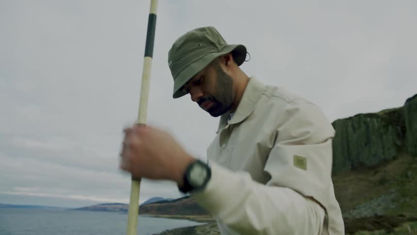 Man playing golf on a coastal course