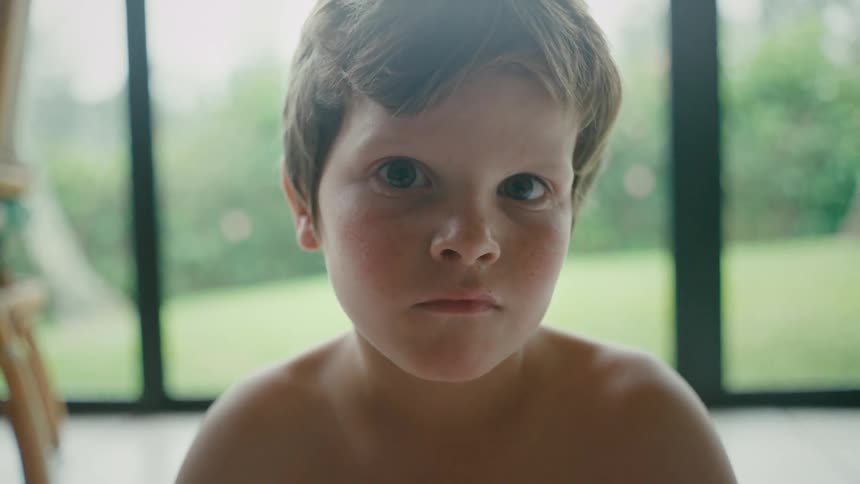 A boy is looking forward