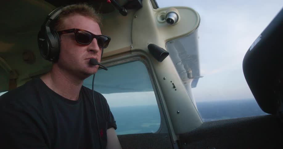 A man is flying an airplane