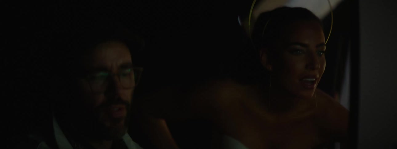 A clip of a lady and a man staring at the screen